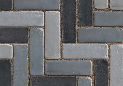 Accent border paver inspired by timeworn European street pavers.